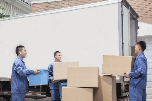 Household moving preparation with labeled boxes and furniture